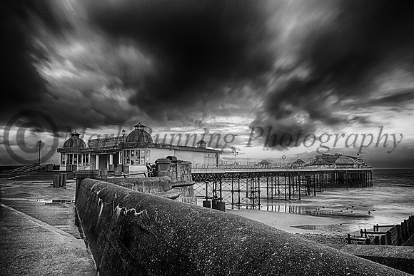 A storm brewing over Cromer pier in monochrome